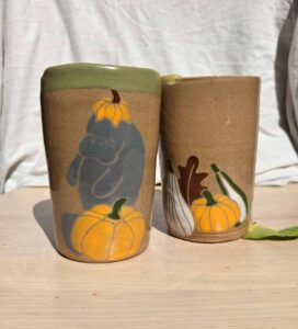 Pottery cups with manatee and pumpkin