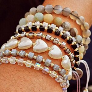 Many bracelets on a wrist