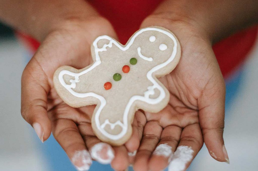 hands holding gingerbread figure